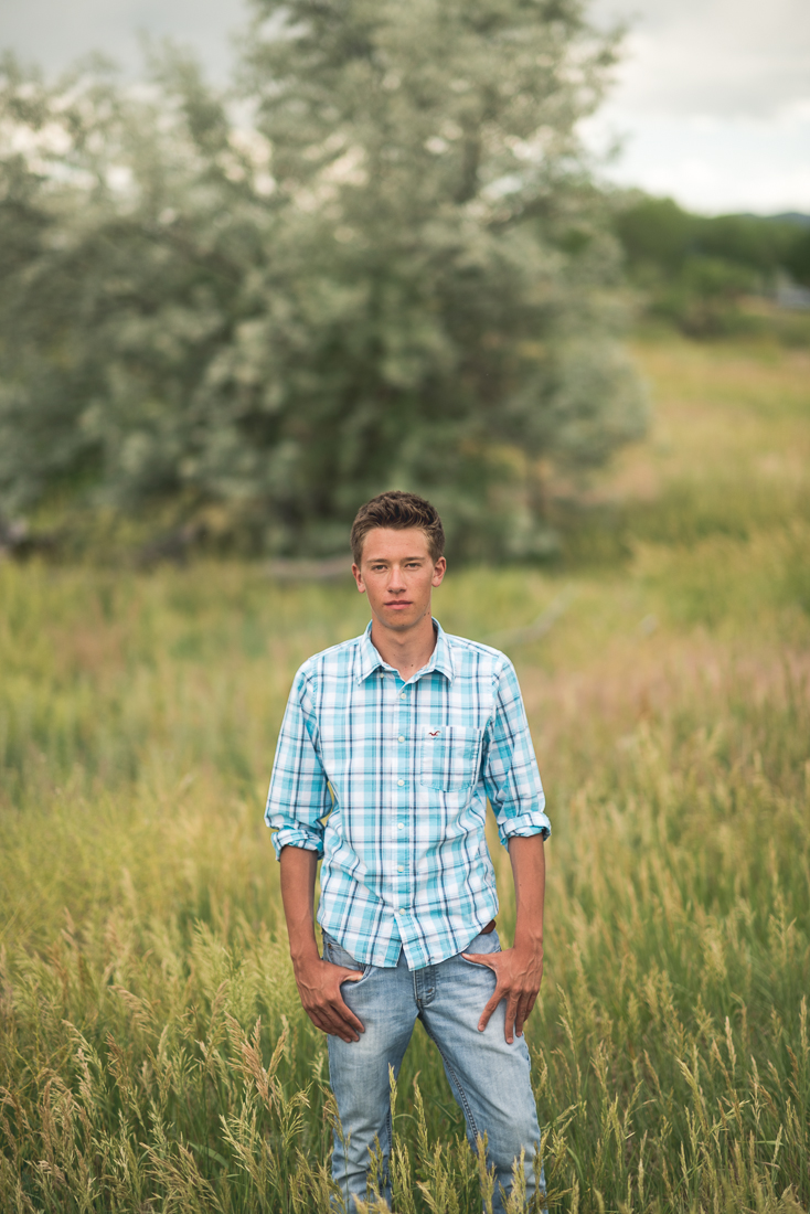 Denver high school senior photo standing in field