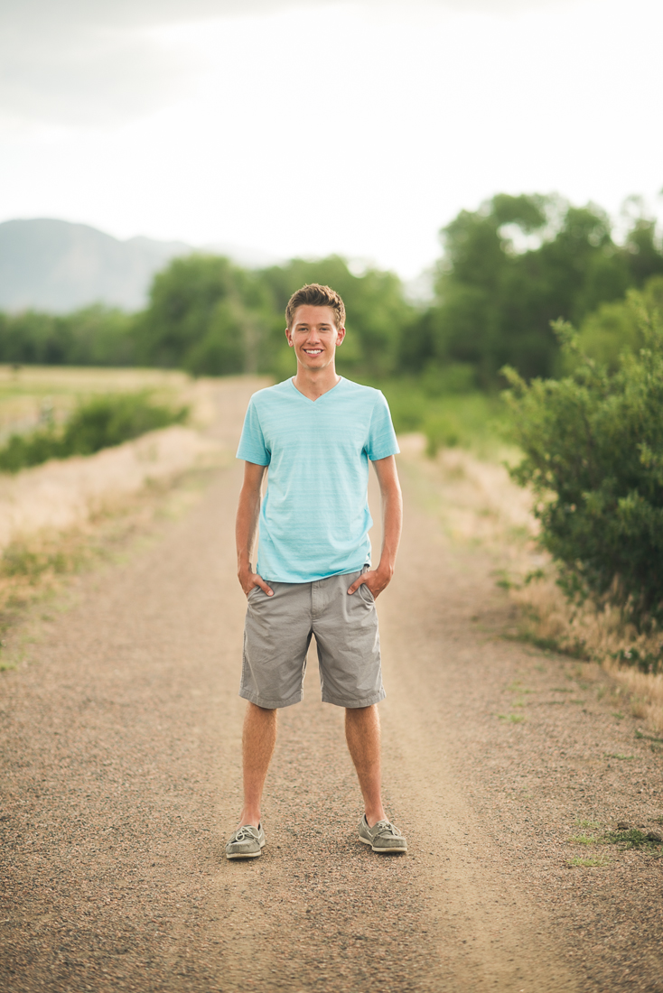 Denver high school senior photo smiling on a trail