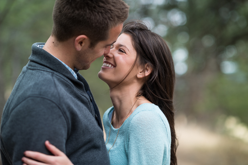 Evergreen engagement photography happy couple in a forest