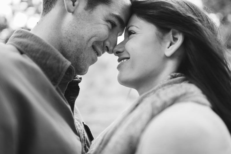 Evergreen engagement photography happy couple in a forest black and white