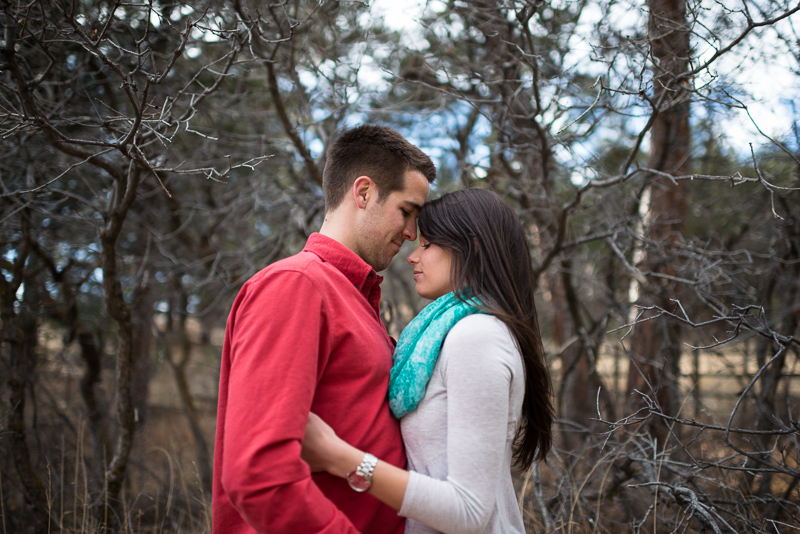 Evergreen engagement photography happy couple in a forest