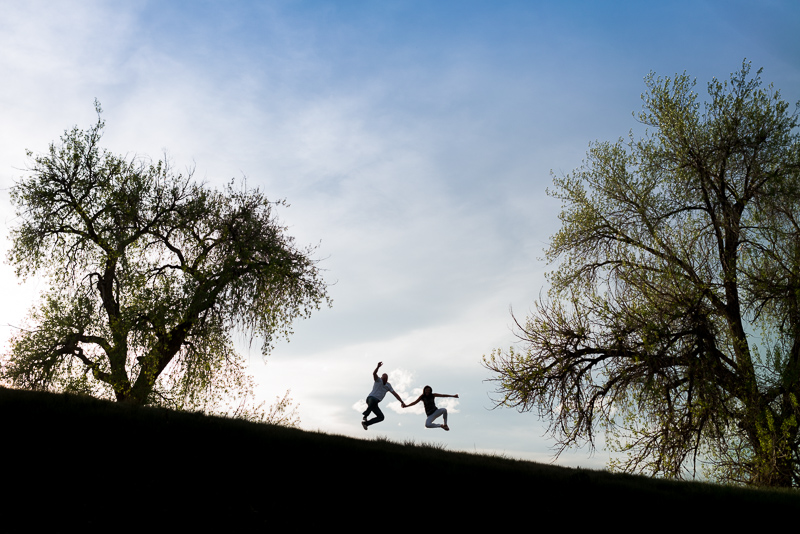Denver Engagement Photography silhouette couple jumping