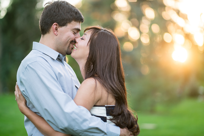 Denver Engagement Photographer kissing sun drenched couple
