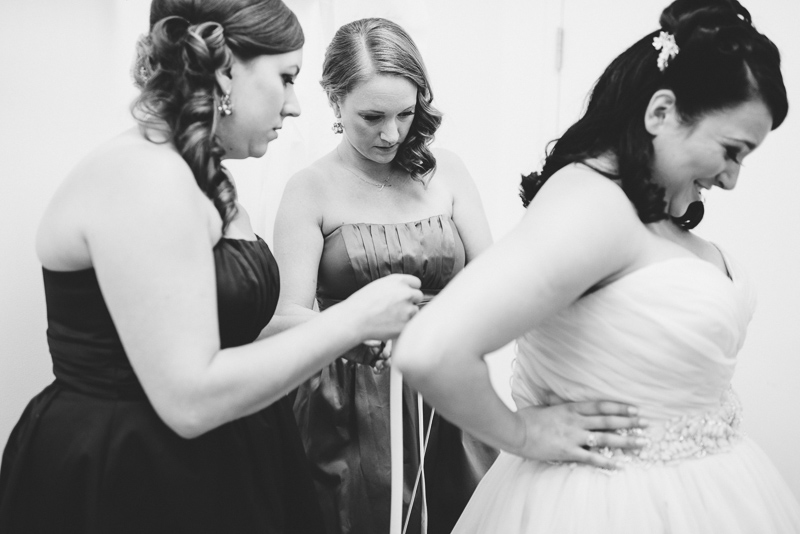 Denver Wedding Photographer Hudson Gardens bride getting dressed