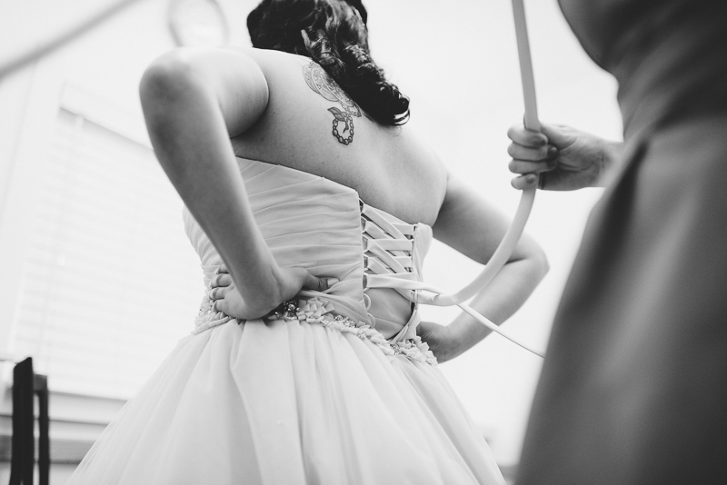 Denver Wedding Photographer Hudson Gardens bride getting dressed