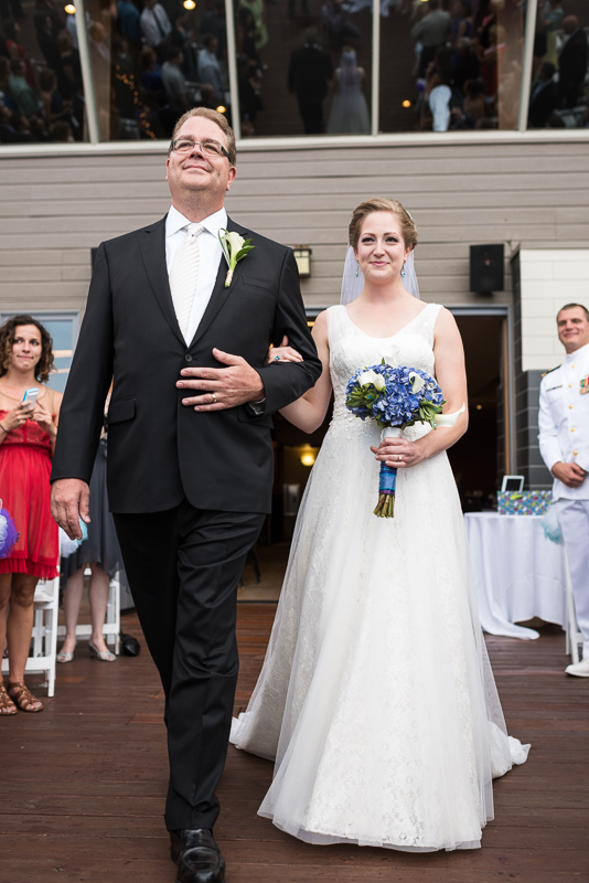 Golden Wedding Photographer bride walking down aisle