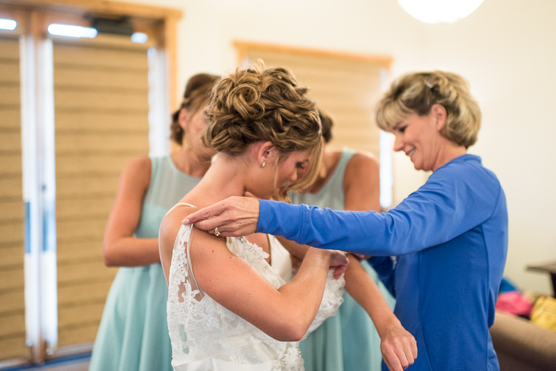 Silverthorne Wedding Photographer bride getting dressed