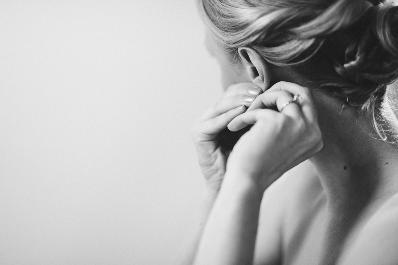 Denver Opera House Wedding Photographer bride getting ready putting in earring