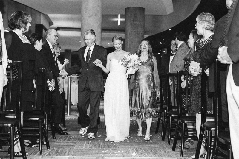 Denver Opera House Wedding Photographer bride walking down aisle