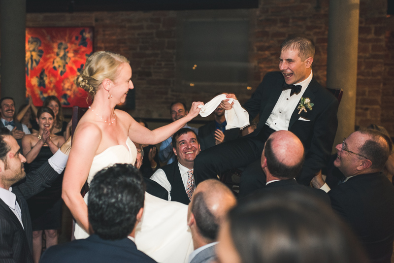 Denver Opera House Wedding Photographer bride and groom on chairs