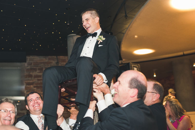 Denver Opera House Wedding Photographer groom on chair