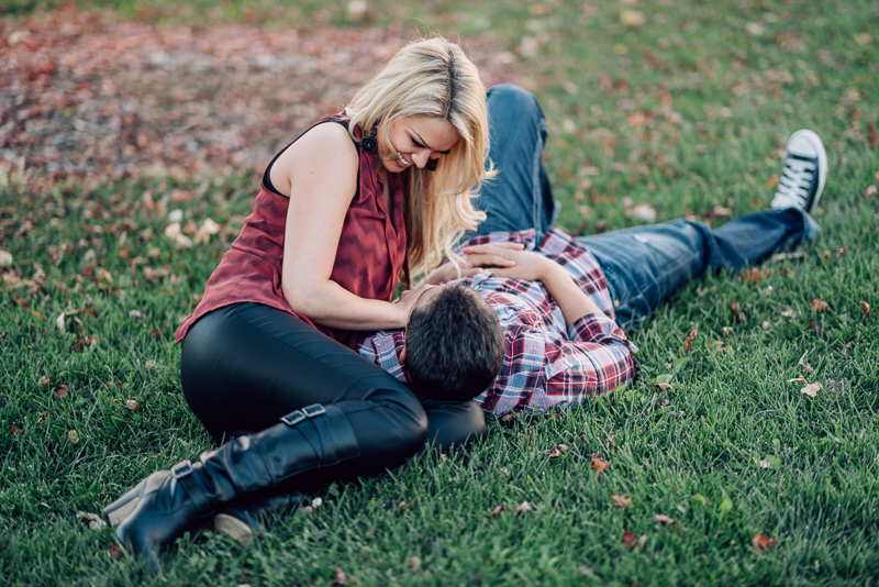 Denver Engagement Photography couple lying in grass