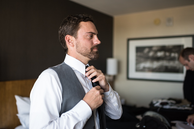 Denver Wedding Photography History Colorado groom putting on tie