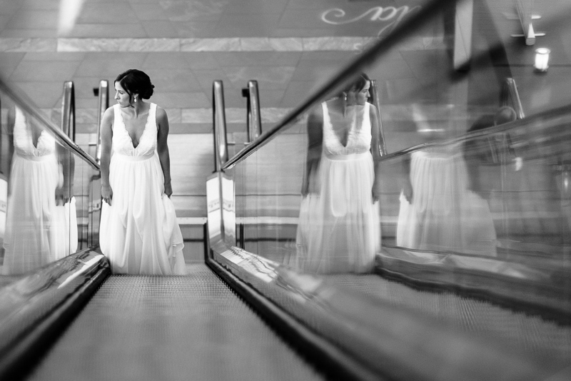 Denver Wedding Photography History Colorado bride on escalator