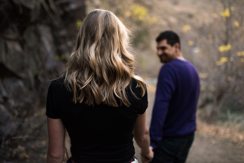 Golden Engagement Photography walking looking back