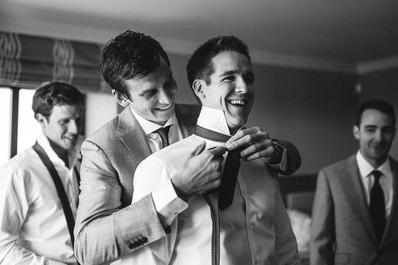 Denver wedding photography tying tie