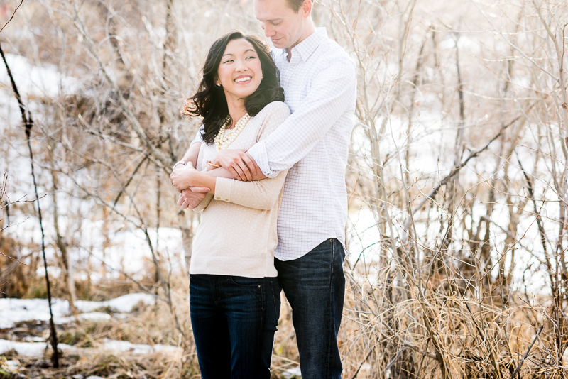 Denver engagement photography couple hugging in trees