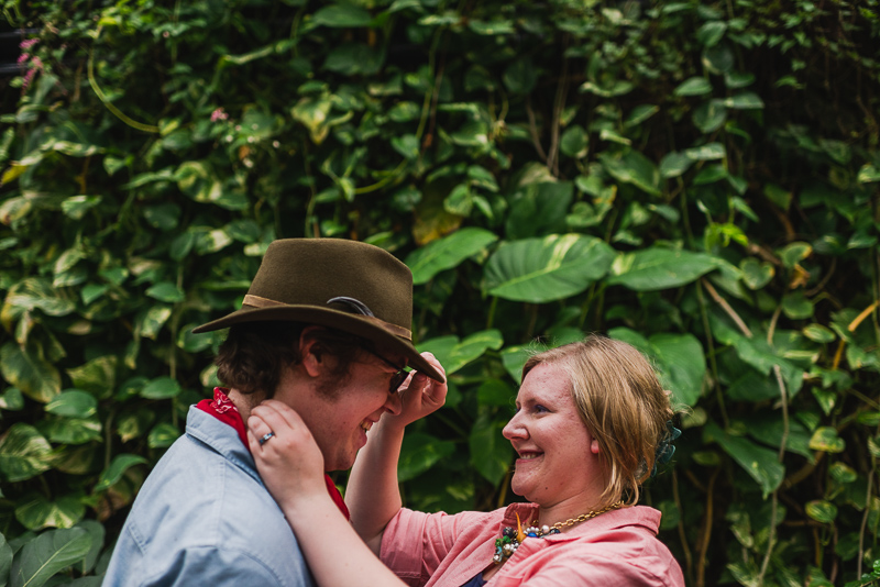 Denver Engagement Photography adjusting hat