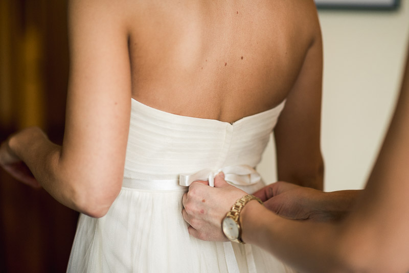 steamboat springs wedding photography tying dress