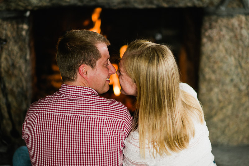 Boulder Engagement Photography sitting by fire