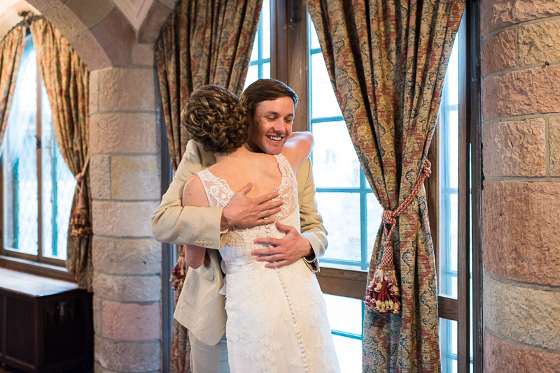 Denver Wedding Photography Cherokee Ranch and Castle first look hug