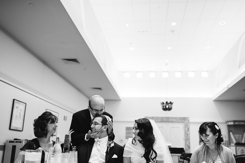 denver jewish wedding photographer dad kissing groom