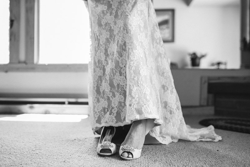 Emily and Ryan Lower Lake Ranch Wedding Photography putting shoes on