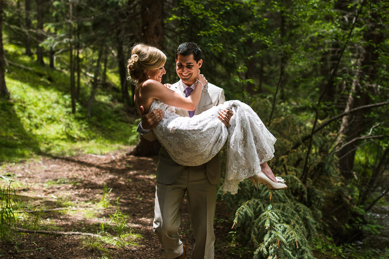 Emily and Ryan Lower Lake Ranch Wedding Photography groom carrying bride