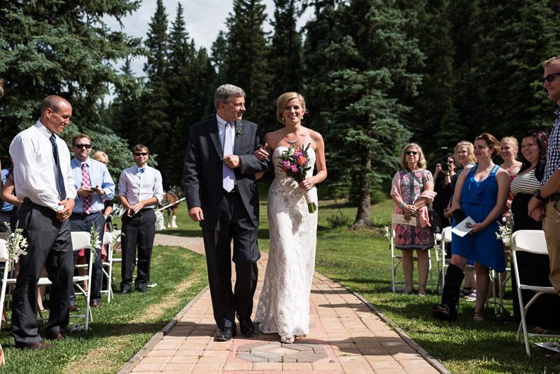 Emily and Ryan Lower Lake Ranch Wedding Photography bride walking down aisle