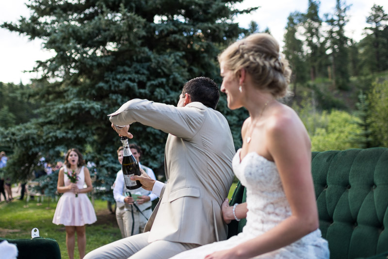 Emily and Ryan Lower Lake Ranch Wedding Photography popping champagne