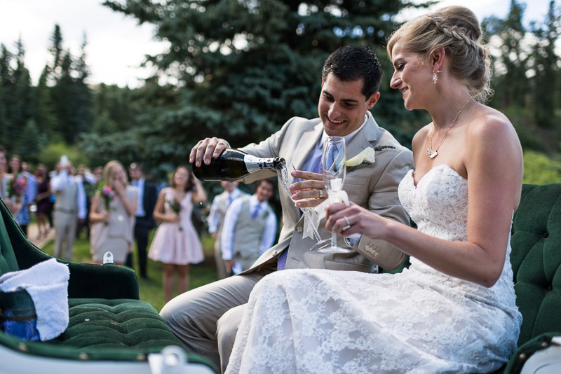 Emily and Ryan Lower Lake Ranch Wedding Photography pouring champagne