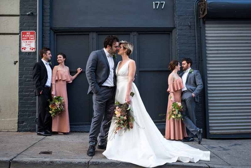 Bridal party kissing