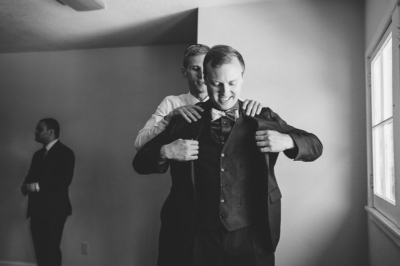 San Francisco Wedding Photography Villa Chanticleer groom putting on jacket