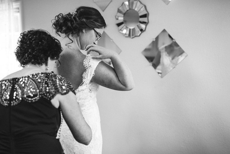 San Francisco Wedding Photography Villa Chanticleer bride putting on dress