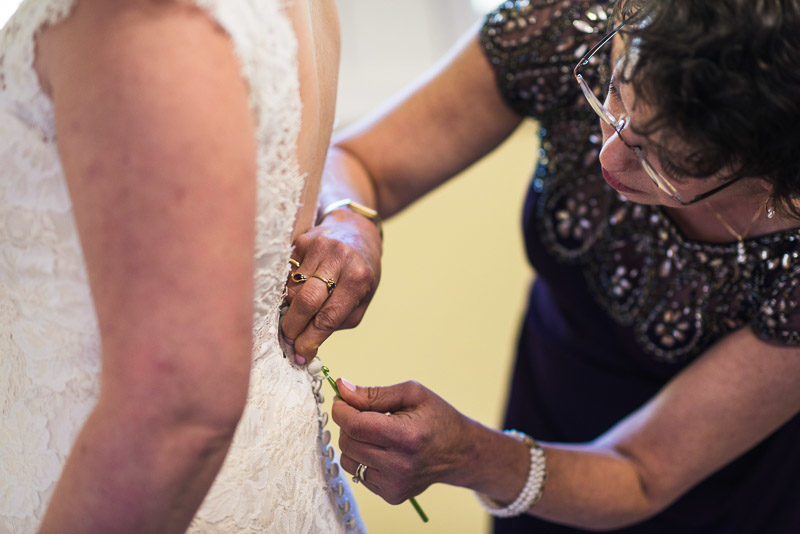 San Francisco Wedding Photography Villa Chanticleer mother helping bride with dress