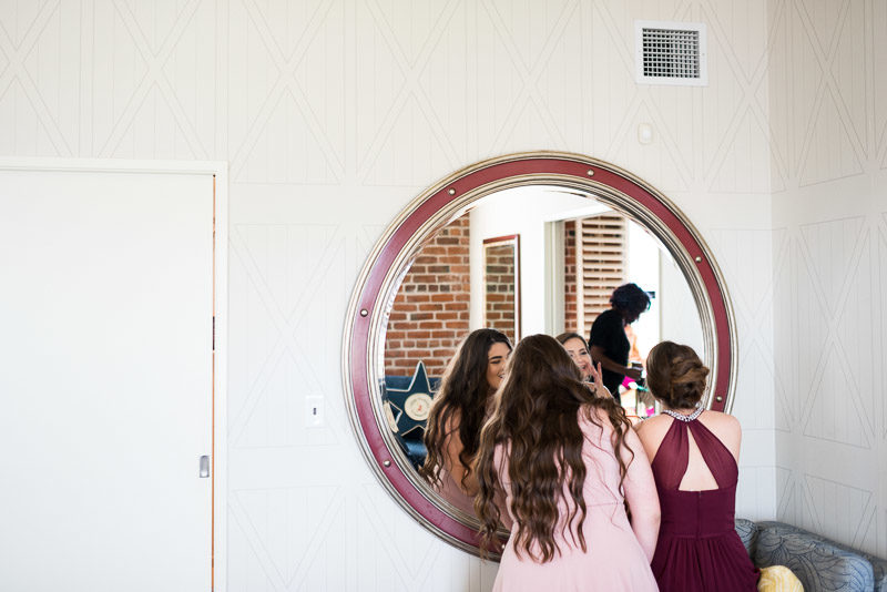 bridesmaids getting ready with mirror
