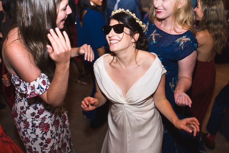 Strauss home ranch wedding bride dancing with sunglasses