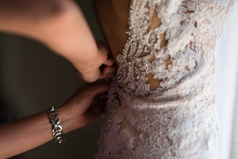 Vail Wedding Photography Camp Hale bride getting dressed