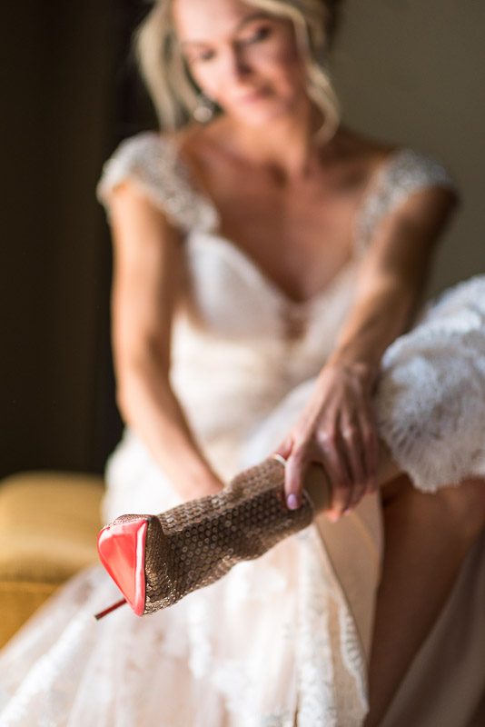 Vail Wedding Photography Camp Hale bride putting on shoes